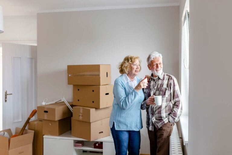 A couple with a new home they purchased with a HECM for purchase