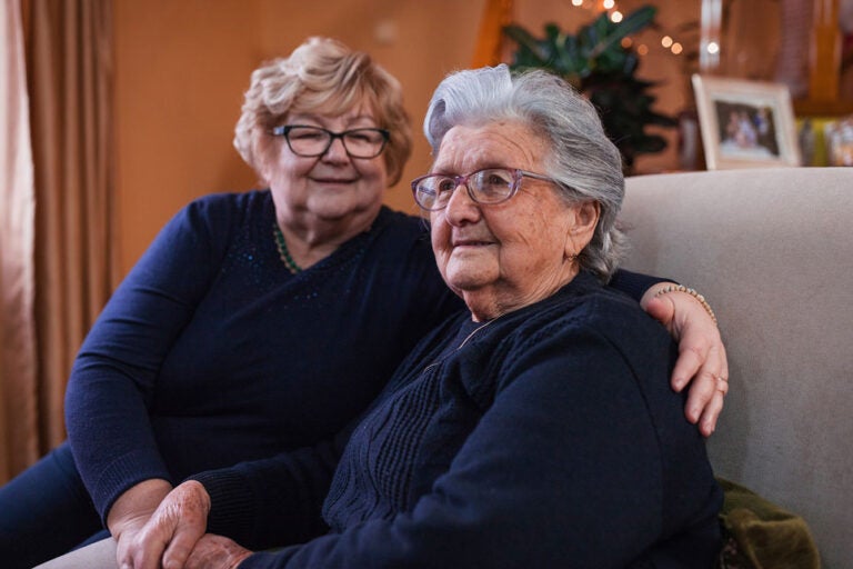 A mother and daughter who have a reverse mortgage together.