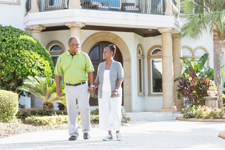 A couple enjoys their home with a jumbo reverse mortgage