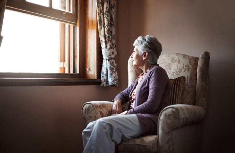 A woman contemplating what it means to outlive a reverse mortgage