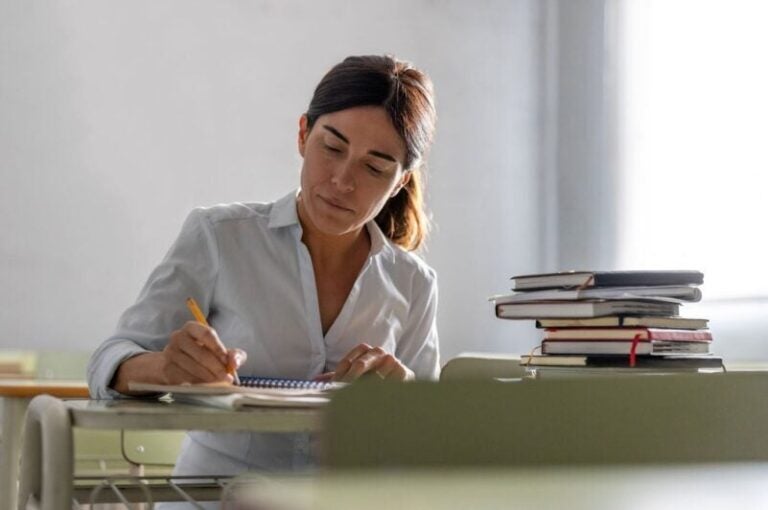 A woman reading reverse mortgage facts and statistics