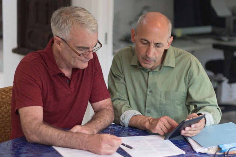 A couple reviewing their reverse mortgage fees