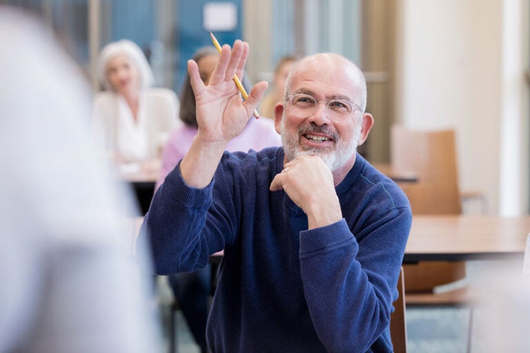 A man in a class asks about smart ways to use reverse mortgage proceeds