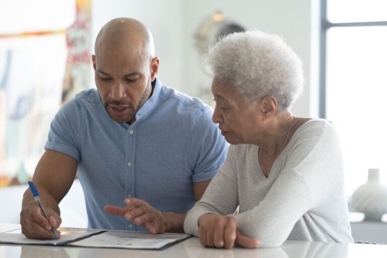 two people learn about title and reverse mortgage