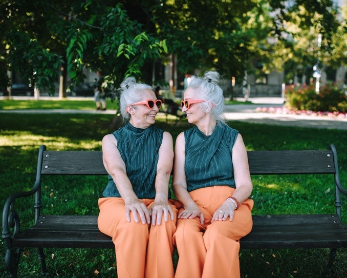 Sisters discussing the differences between traditional mortgages and reverse mortgages