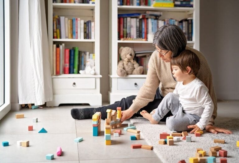 A woman and her grandchild playing blocks